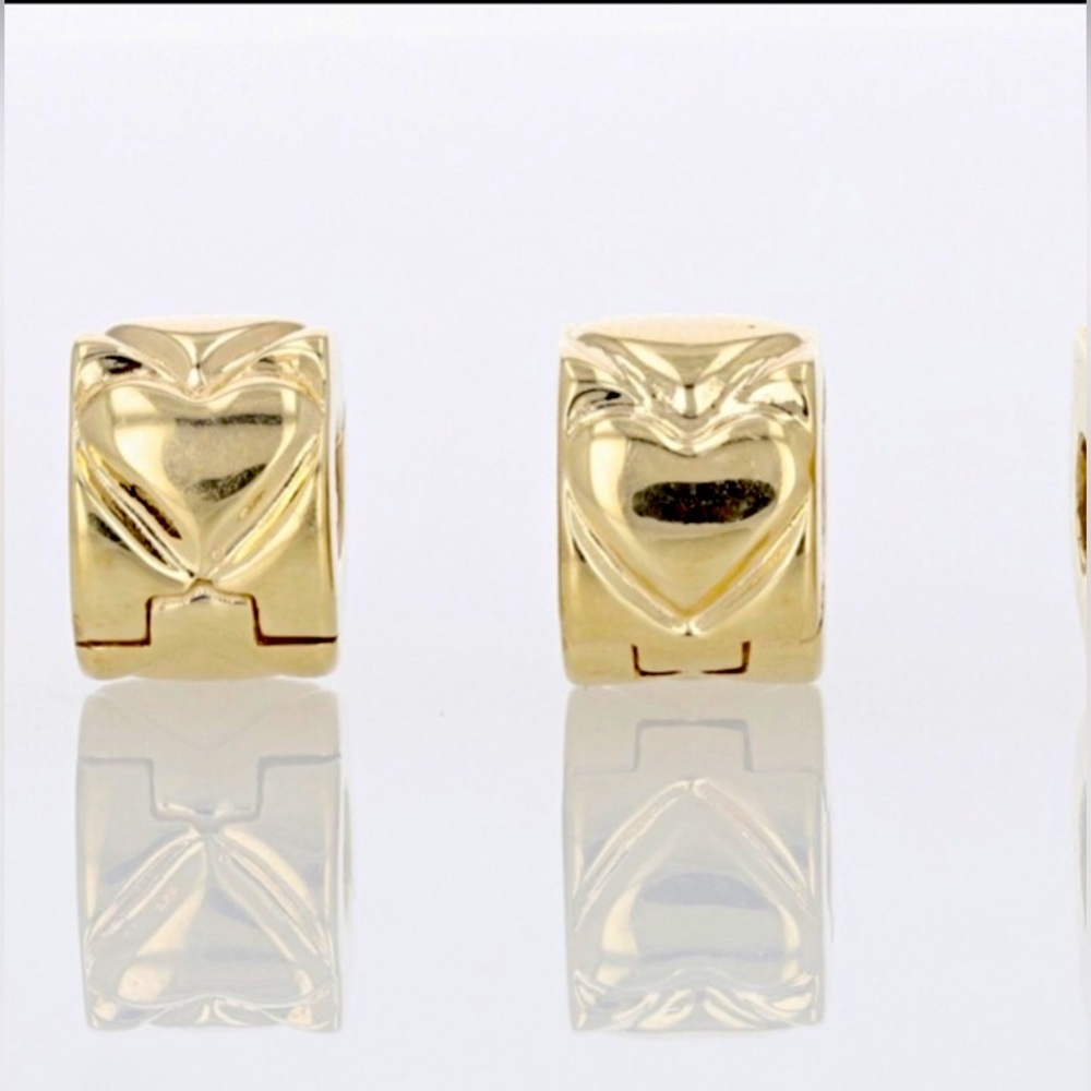 14K yellow gold Pandora heart clips.